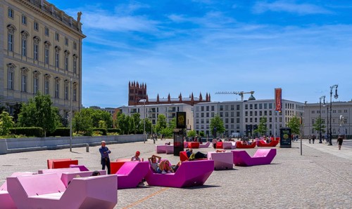 Colourful seating elements on the open space in front of the entrance to the Humboldt Forum,
