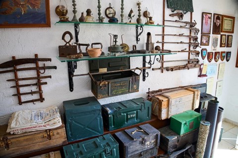 Shelves with antique weapons, lamps and crates in a military museum, war museum, military museum,