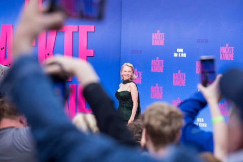 Pamela Anderson between fans at the film premiere of The Naked Gun at UCI Luxe East Side Gallery,