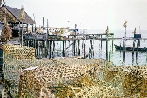 Wicker fish traps and wooden jetties in fishing village on stilts, Singapore, southeast Asia 1963