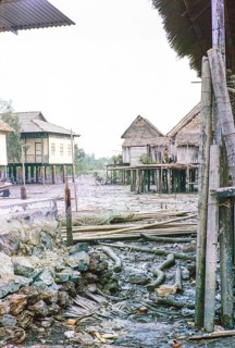 Low tide in fishing village of attap houses built on stilts, Singapore, southeast Asia 1963