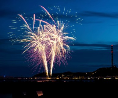 Spectacularly brilliant, atmospheric fireworks display for the Heligoland island festival in red,
