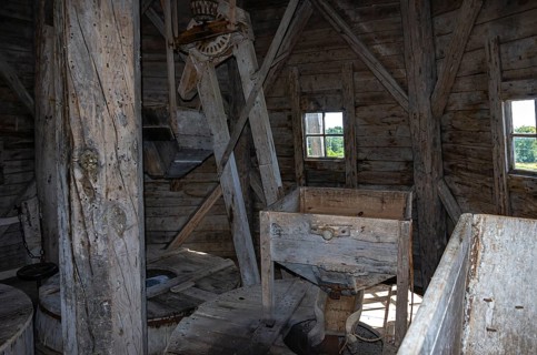 Interior view of a historic windmill near the burial ground of Stenhusbacken and the village of