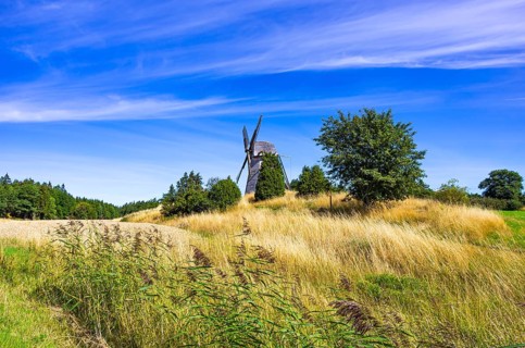 Historic windmill in an epic summer landscape near the burial ground of Stenhusbacken and the