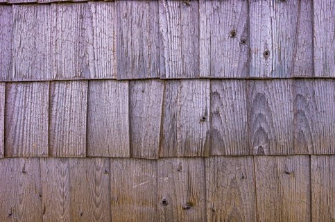 Traditional wooden shingles are used as panelling and façade cladding, exemplified on a historic