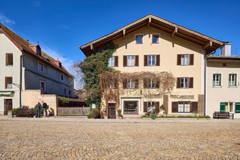 Historic houses, facade, window, door, shutters, square, cobblestones, blue sky, cirrostratus