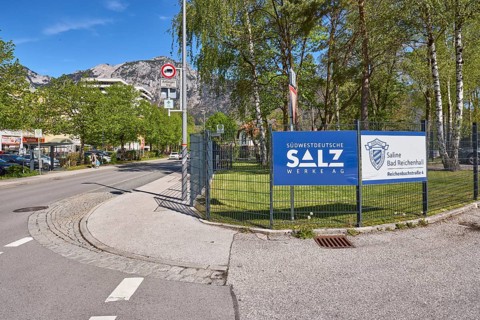 Südwestdeutsche Salzwerke AG, Bad Reichenhall salt works, metal fence, advertising sign, trees,