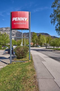 PENNY Markt GmbH, discounter, advertising sign, mountain landscape, mountains, trees, lawn, road,