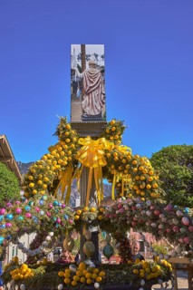Easter fountain, Easter decoration, blown out coloured Easter eggs, trees, historical buildings,