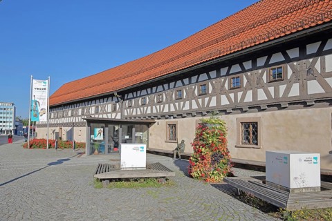 Entrance to the arms museum built in 1668, half-timbered house, banner, museum, Suhl, Franconia,