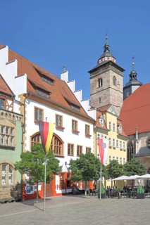 Houses and German national flag with Thuringian state flag, St George's Church, Altmarkt,
