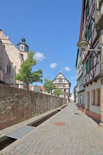 Half-timbered houses with rivulet and St George's Church, Bächle, Bächlein, churchyard,