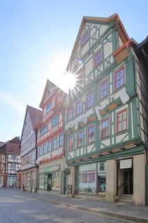Red, green and brown half-timbered houses against the light, colourful, Auer Gasse, Schmalkalden,