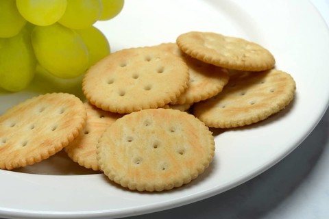 Crackers, crackers with grapes on a plate