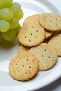 Crackers, crackers with grapes on a plate