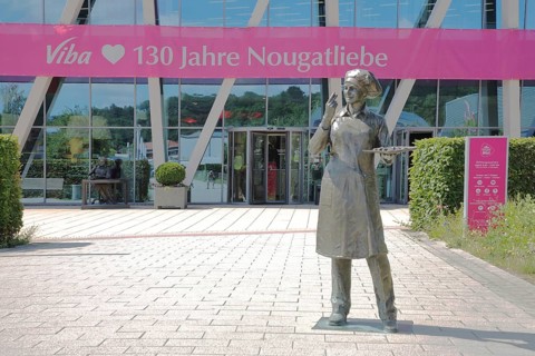 Sculpture confectioner with tray full of pralines for tasting, presentation, eating, enjoyment,