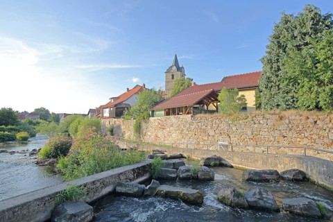 Werra with fish ladder, bank with stones, rocks, barrage, town wall, St Bartholomew's Church,