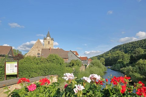 Werra bridge with geraniums and St Bartholomew's Church, bank, houses, idyll, flower decoration,