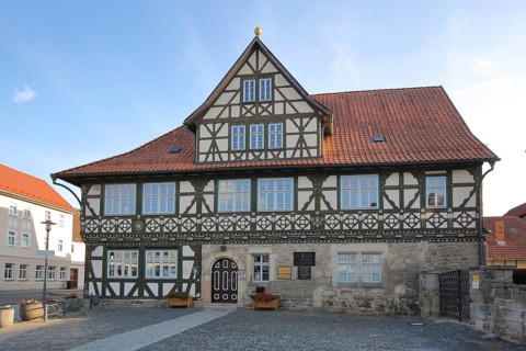 Historic official residence built in 1665, half-timbered house, hipped roof, Themar, fieldstone,