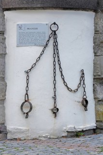 Medieval pillory with chains and rings, shackles, metal fittings, fittings, inscription, text, town