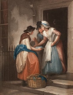 Fresh mackerel, fishmonger offers her wares at the front door, two customers buy the fish, England,