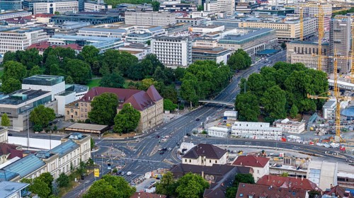 View of Stuttgart city centre. Crossroads at Gebhard-Müller-Platz. Top right the main railway
