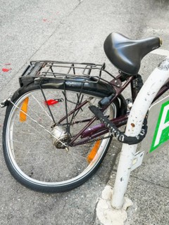 Deformed rear wheel of a bicycle in Vienna, Austria