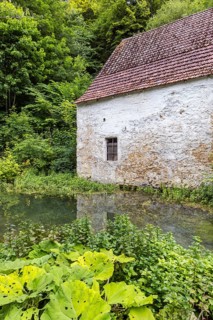 Old barn. The building is located near the source of the Zwiefalter Ach river at the Wimsen Cave