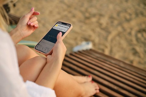 Unrecognizable woman got an emergency alert message on her smartphone