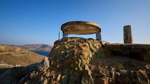 Derelict bunker structure on a hill with sea and mountains in the background, Lost Place, Lago