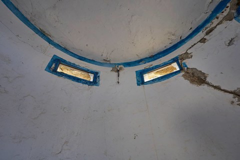 Interior of an abandoned dome with blue window frames and peeling plaster, Lost Place, Lago