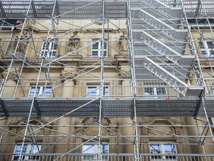 Scaffolded façade of the district court with metal platforms and stairs in Wuppertal, Germany