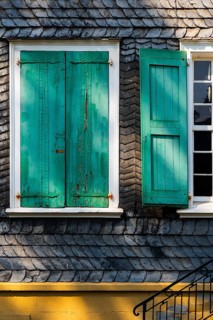 Weathered green shutters on a slate-clad house in Wuppertal, Germany