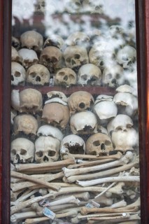Shrine with human skull, memorial to the victims of the Khmer Rouge regime, Wat Thmei, Siem Reap,