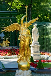 Fountain figure of the goddess Fama with fanfare in gold, Rococo style, west parterre, palace park