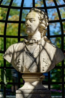 Decorative bust, nobleman in rococo style in the arcade, park of Linderhof Castle, UNESCO World