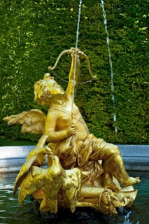 Fountain figure of Cupid, god of love, in gold with bow and arrow, Rococo style, east parterre,
