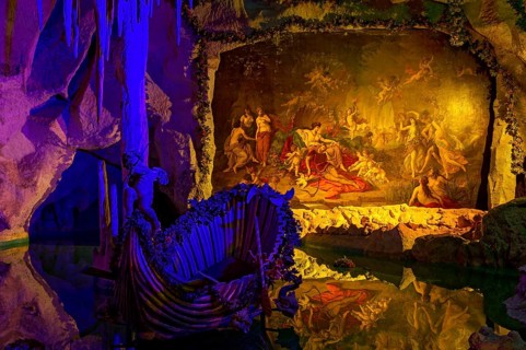 Colourful illumination of King Ludwig II's Venus Grotto, artificial stalactite cave, lake with