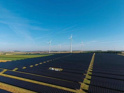Extensive solar panels with wind turbines in sunny surroundings, near Kitzingen, Lower Franconia,
