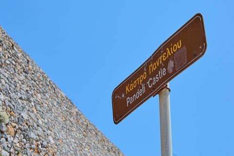 Signpost to Pandeli Castle under a clear sky, Pandeli Castle, Castle, Leros Fortress, St John's