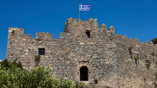 Stone castle with Greek flag and window, Pandeli Castle, Castle, Leros Fortress, St John's