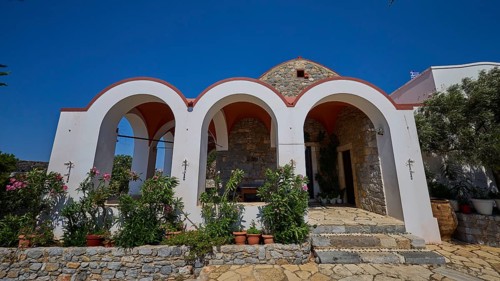 Panagia Kyra Church, Panagia tou Kastrou, Small church with striking arches and flowerbeds against