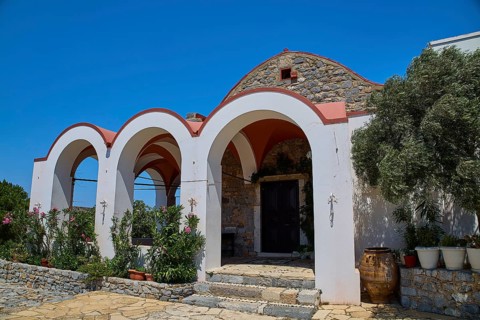 Panagia Kyra church, Panagia tou Kastrou, building with arched entrances and plants, Pandeli