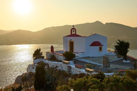 Chapel on a hill overlooking the sea and the mountains at sunset, Profitis Ilias Church, Prophet