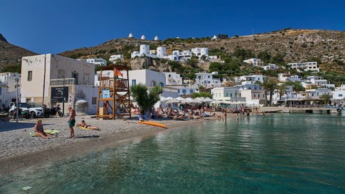 Coastal town with beaches and houses on the hillside under a clear sky, Pandeli Beach, Pandeli