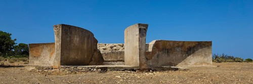 Old concrete ruins under a clear blue sky in an arid landscape, Lost Place, Air Defence Position,