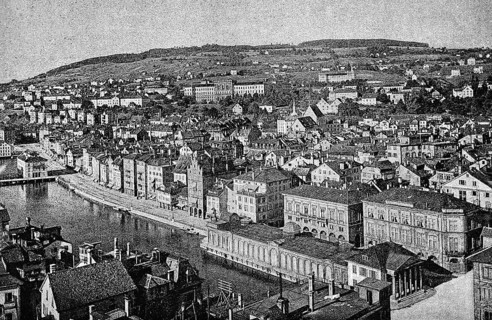 Cityscape of Zurich, view from the old town church of St Peter, old town on the Limmat, mountain,