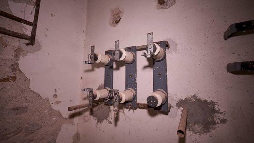 Lost Place, close-up of old electrical connections in a dilapidated building, Radio Station, WW2,