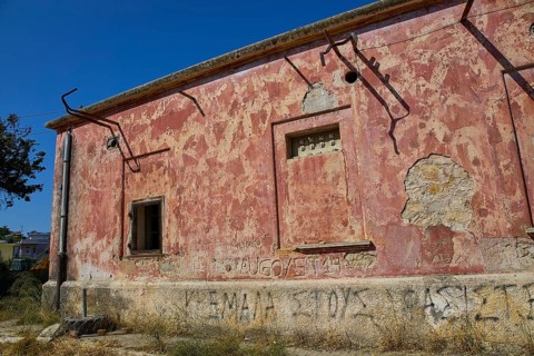 Lost Place, Dilapidated building with red walls, graffiti and a window under a blue sky, Radio