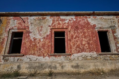 Lost Place, The facade of a dilapidated building with red and white discolouration, Radio Station,